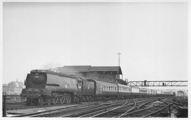 BR(S) West Country class 34006 'Bude' at Clapham Junction, Greater London with a Waterloo - Southampton Docks Boat Train on Saturday 21 Jul 1951 - J.H.W. Kent [001729]