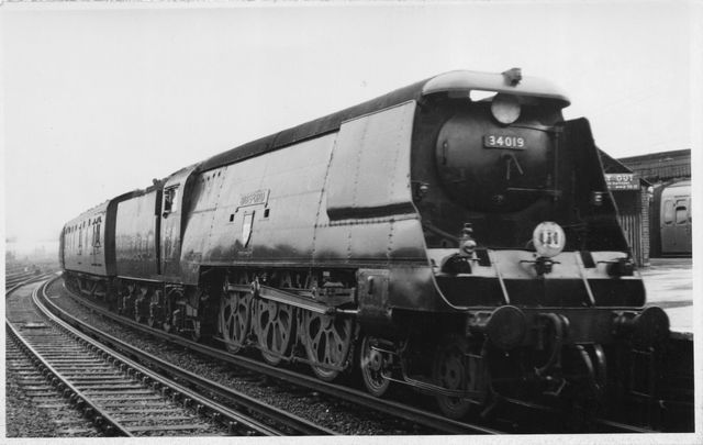 BR(S) West Country class 34019 'Bideford' at Clapham Junction, Greater London with a Waterloo - West of England service on Saturday 11 Aug 1951 - J.H.W. Kent [001799]