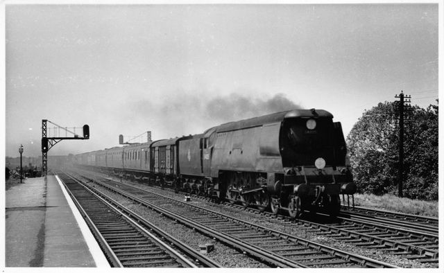 BR(S) West Country class 34025 'Whimple' at Raynes Park Station, Greater London with a West of England - Waterloo service on Saturday 25 May 1957 - J.H.W. Kent [001828]