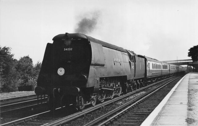 BR(S) West Country class 34032 'Camelford' at Raynes Park Station, Greater London with a Waterloo - West of England service on Saturday 18 Aug 1951 - J.H.W. Kent [001858]