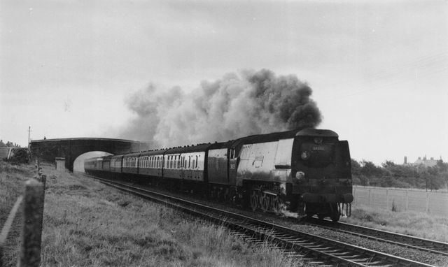 BR(S) West Country class 34039 'Boscastle' west of Cosham, Hampshire with a Brighton - Bournemouth West or vv service on Saturday 12 Sep 1953 - J.H.W. Kent [001886]