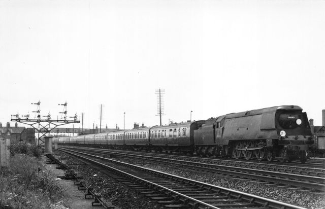 BR(S) West Country class 34043 'Combe Martin' at Mount Pleasant Crossing, Southampton, Hampshire with a Bournemouth - Waterloo service on Thursday 25 Jul 1957 - J.H.W. Kent [001910]