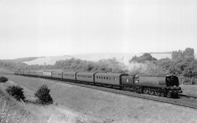 BR(S) West Country class 34046 'Braunton' at Patcham, East Sussex with an Inter Regional via Kensington Olympia - Brighton service on Saturday 23 Jul 1955 - J.H.W. Kent [001937]