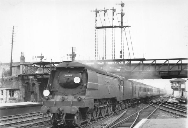 BR(S) Battle of Britain class 34063 '229 Squadron' at Eastleigh Station, Hampshire with a Waterloo - Bournemouth service on Wednesday 27 Aug 1952 - J.H.W. Kent [002024]