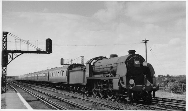BR(S) King Arthur class 30746 'Pendragon' at Raynes Park, Greater London with a Bournemouth - Waterloo service on Saturday 20 Jun 1953 - J.H.W. Kent [003501]