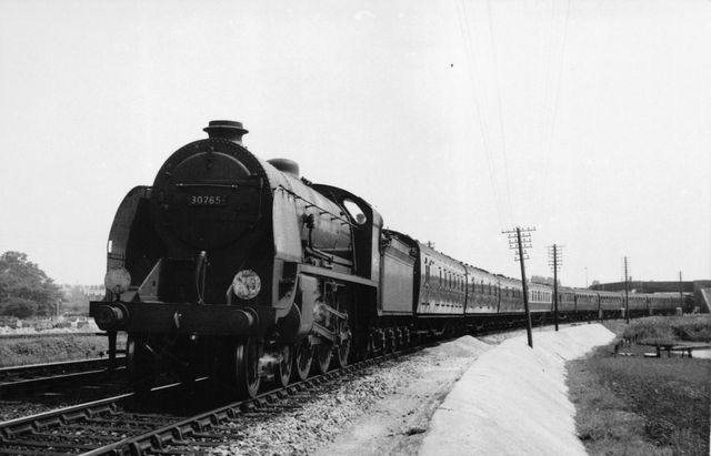 BR(S) King Arthur class 30765 'Sir Gareth' leaving Poole, Holes Bay Curve, Dorset with a Waterloo - Weymouth service on Saturday 19 Jul 1958 - J.H.W. Kent [003600]