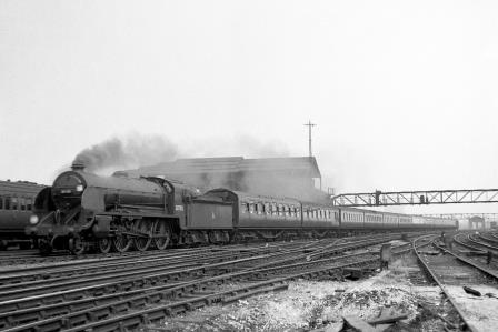 BR(S) King Arthur class 30785 'Sir Mador de la Porte' at Clapham Junction, Greater London with a Waterloo - Basingstoke service on Saturday 21 Jul 1951 - J.H.W. Kent [025158]