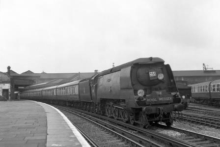 BR(S) Battle of Britain class 34110 '66 Squadron' at Clapham Junction Station, Greater London with an up Royal Wessex service on Saturday 11 Aug 1951 - J.H.W. Kent [025216]