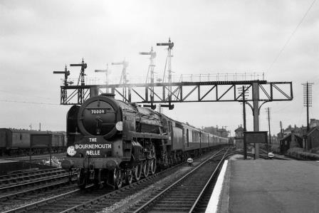 BR(S) Britannia class 70009 'Alfred the Great' at Eastleigh Station, Hampshire with the up "Bournemouth Belle" on Friday 24 Aug 1951 - J.H.W. Kent [025348]