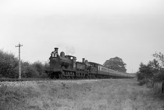 BR(S) O1 class 31048 at Pattenden Siding, Kent with an up RCTS The Wealden Limited service on Sunday 14 Aug 1955 - J.J. Smith [040129]