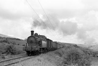 SLNCR Lough class 'Lough Melvin' at No 9 crossing west of Glenfarne, Ireland with the 2.00pm Freight Enniskillen - Sligo on Friday 22 Jun 1956 - J.J. Smith [040445]