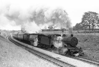 BR(M) 2P class 40698 & BR(S) West Country class 34105 'Swanage' near Prestleigh, Somerset with the 11.12am Bournemouth West - Derby service on Saturday 28 Jul 1956 - J.J. Smith [040568]