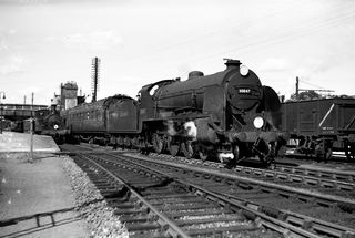 BR(S) S15 class 30847 at Axminster, Devon with the 3.34pm to Templecombe on Thursday 15 Jun 1950 - J.J. Smith [040856]