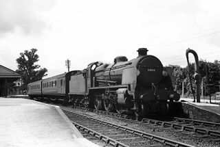 BR(S) N class 31832 at Launceston Station, Cornwall with the 1.00pm Padstow - Okehampton service on Wednesday 21 Jun 1950 - J.J. Smith [040913]
