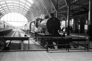 BR(M) 2P class 40697 & BR(S) West Country class 34041 'Wilton' at Bath Green Park, Somerset with the 12.20pm Bournemouth West - Nottingham service on Saturday 24 Jun 1961 - J.J. Smith [041740]