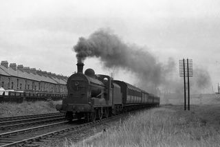 49 west of Central Junction, Ireland with the 12.45pm Belfast - Newcastle service on Saturday 04 Jul 1953 - J.J. Smith [043457]