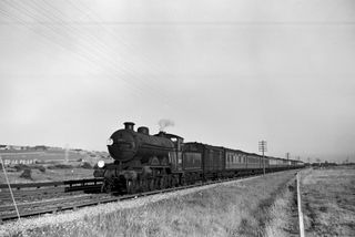 BR(S) Brighton Atlantic class 32422 'North Foreland' near Southerham Junction, East Sussex with the 6.40pm Newhaven - Victoria service on Sunday 09 Aug 1953 - J.J. Smith [043510]