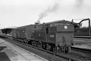 BR(S) M7 class 30048 at Three Bridges, West Sussex with the 1.06pm Vans Three Bridges - Horsham on Thursday 24 Dec 1953 - J.J. Smith [043596]