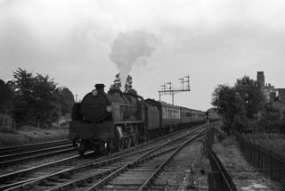 BR(S) U1 class 31908 at Ashford B Signal Box, Kent with the 1.45pm Margate - Nottingham service on Saturday 14 Aug 1954 - J.J. Smith [043971]