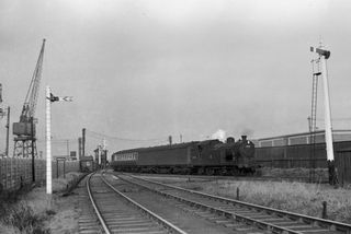 BR(E) N7 class 69630 at Connaught Road, Greater London with the 10.33am Liverpool Street - George V Dock service on Saturday 27 Nov 1954 - J.J. Smith [044122]