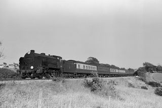 BR(S) Schools class 30910 'Merchant Taylors' in West Sussex with the 6.56pm Hastings - Tonbridge service on Sunday 16 Jun 1957 - J.J. Smith [044421]
