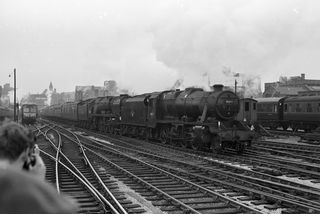 BR(M) 8F class 48417 & BR(S) West Country class 34039 'Boscastle' at Birmingham Snow Hill Station, West Midlands with the 7.43am from Southampton Central via Worcester on Saturday 27 Apr 1963 - J.J. Smith [046394]