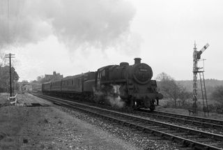 BR Std 4MT class 76027 at Holmsley, Hampshire with the 2.03pm Brockenhurst - Bournemouth West service on Saturday 02 May 1964 - J.J. Smith [046707]