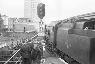 BR(S) West Country class 34013 'Okehampton' at Portsmouth Harbour, Hampshire with the "SCTS The Southdown Venturer" Rail Tour on Sunday 20 Feb 1966 - J.J. Smith [047263]