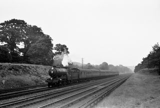BR(S) Brighton Atlantic class 32421 'South Foreland' near Three Bridges, West Sussex with the 10.51am Hastings - Leicester service on Saturday 30 Jul 1955 - C. Hogg [048326]
