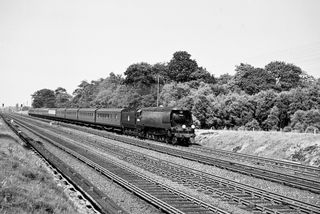 BR(S) West Country class 34048 'Crediton' near Three Bridges, West Sussex with the 11.05am Walsall - Hastings (via Kensington Olympia) service on Saturday 23 Jul 1955 - C. Hogg [048371]