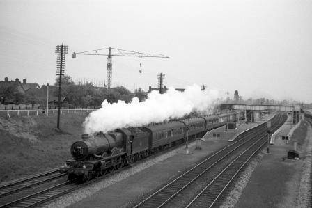 BR(W) Castle class 7009 'Athelney Castle' at Iver Station, Buckinghamshire with a down Passenger Service circa 2 Jun 1962 - J.H.W. Kent [075192]