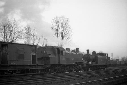 BR(M) 2MT class 41291 & BR(S) E4 class 32468 passing Preston Park Pullman Car Works, West Sussex with a down Goods service on Wednesday 19 Dec 1962 - J.H.W. Kent [079195]