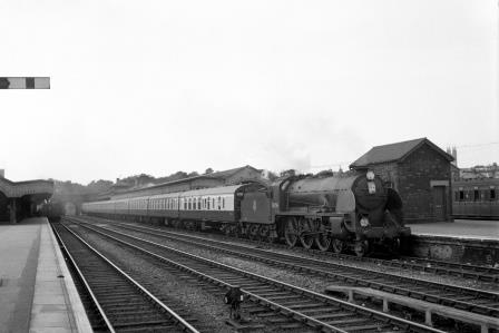 BR(S) King Arthur class 30796 'Sir Dodinas le Savage' at Ashford Station, Kent with a Charing Cross - Kent Coast service on Saturday 26 Jul 1952 - J.H.W. Kent [090376]