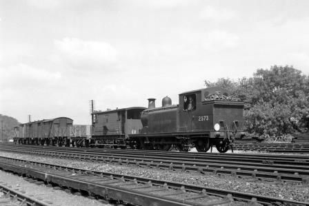 BR(S) E5 class 2573 passing Preston Park Pullman Car Works, East Sussex with a down Goods service on Monday 28 Jul 1952 - J.H.W. Kent [090389]