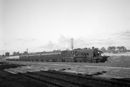 BR(S) U class 31802 at Stoneham Sidings, Hampshire with a down Southampton Terminus service on Wednesday 27 Aug 1952 - J.H.W. Kent [090559]