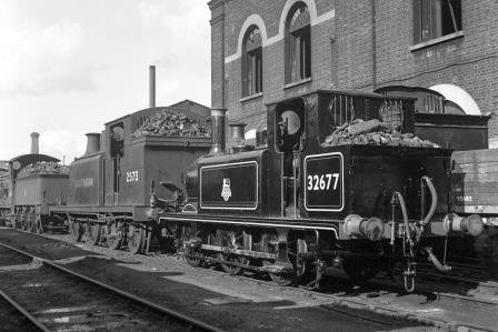 BR(S) Terrier class 32677 & BR(S) E5 class 2573 at Brighton Shed, East Sussex on Sunday 28 Sep 1952 - J.H.W. Kent [090628]