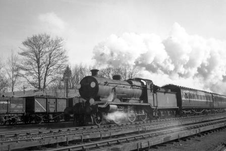 BR(S) K class 32338 passing Preston Park Pullman Car Works, East Sussex with an up Passenger service on Friday 20 Feb 1953 - J.H.W. Kent [090749]