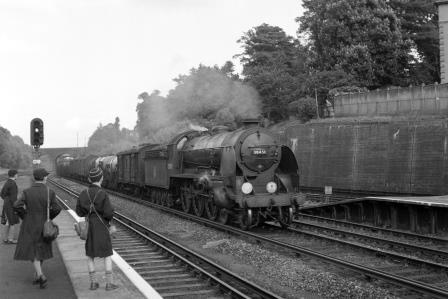 BR(S) King Arthur class 30451 'Sir Lamorak' at Surbiton Station, Greater London with a Clapham Junction - West of England Milk Empties service on Saturday 30 May 1953 - J.H.W. Kent [090854]