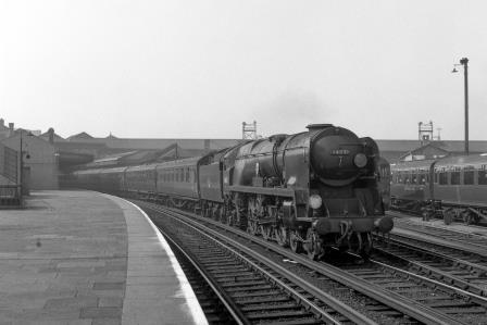 BR(S) West Country class 34031 'Torrington' at Clapham Junction Station, Greater London with a Bournemouth - Waterloo service on Saturday 04 Apr 1959 - J.H.W. Kent [092353]