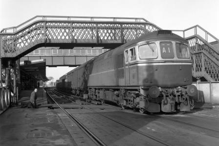 BR Class 33 D6507 at Chichester Station, West Sussex with an Eastbound Goods circa 1964 - J.H.W. Kent [093376]