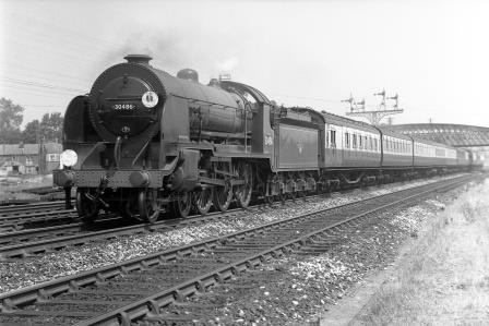 BR(S) H15 class 30486 passing Bevois Park Sidings, south of St Denys, Hampshire with a Waterloo - Bournemouth or Weymouth service on Saturday 29 Jun 1957 - J.H.W. Kent [094495]