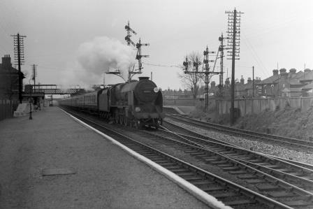 BR(S) Lord Nelson class 30854 'Howard of Effingham' at St Denys Station, Hampshire with a Waterloo - Bournemouth or Weymouth service on Saturday 15 May 1954 - J.H.W. Kent [094696]