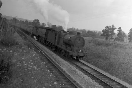 BR(M) 4F class 44102 & BR(S) West Country class 34041 'Wilton' near Evercreech Junction, Somerset with an Inter Regional train (down train?) on Saturday 21 Aug 1954 - J.H.W. Kent [094781]