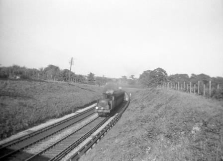 BR(S) M7 class 30048 near Horsham, West Sussex with the 6.18pm Horsham - Guildford service on Friday 02 Aug 1957 - J. Scrace [140009]