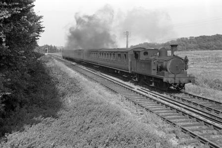 BR(S) O2 class W22 'Brading' between Brading and Sandown, Isle of Wight with the 3.00pm Ryde Pier Head - Shanklin service on Saturday 03 Sep 1966 - J. Scrace [141023]