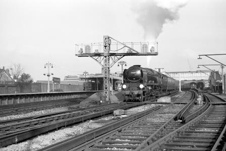 BR(S) West Country class 34026 'Yes Tor' at Horsham Station, West Sussex with the 11.28am Norbury - Southampton Football Special on Saturday 07 Nov 1964 - J. Scrace [141308]