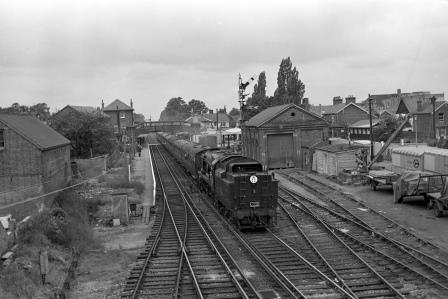 BR(S) Battle of Britain class 34050 'Royal Observer Corps' at Crawley Station, West Sussex with the "LCGB The Wealdsman Rail Tour" on Sunday 13 Jun 1965 - J. Scrace [141393]