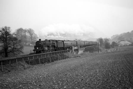 BR Std 5MT class 73171 at Buriton Bank, Hampshire with the 4.11pm Bournemouth Central - Waterloo service on Sunday 20 Mar 1966 - J. Scrace [142230]