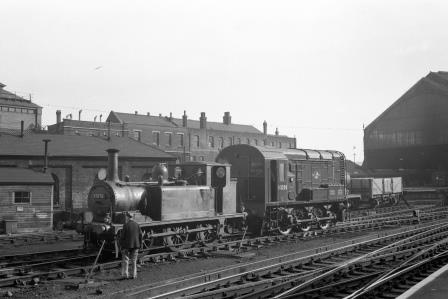 BR(S) Terrier class 32670 & BR Class 08 D3220 at Brighton Shed, East Sussex in Nov 1958 - J.H.W. Kent [150470]
