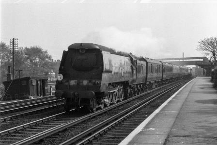 BR(S) West Country class 34018 'Axminster' at Raynes Park Station, Greater London with a Waterloo - Southampton Docks service on Saturday 26 Apr 1952 - J.H.W. Kent [153353]